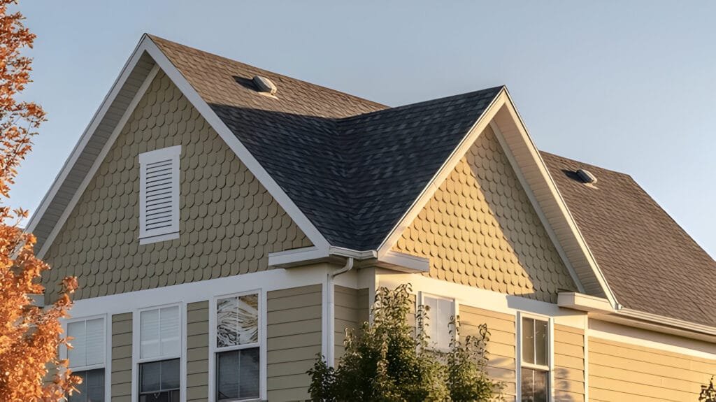 home with a brown roof and white trim, showcasing quality roofing services.