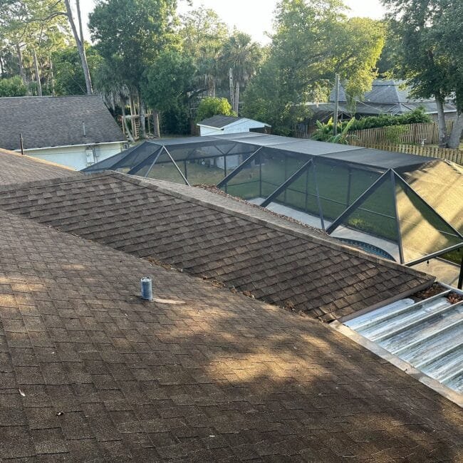 Roof covered in debris awaiting a clean-up and repair from Gotcha Covered Roofing